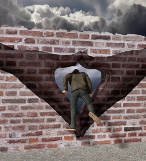 Man climbs through Merkel diamond on a Wall