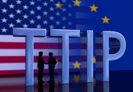 Two businessmen shaking hands in front of USA flag and EU flag