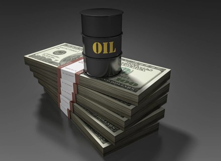 Oil barrel standing on stack of dollar bills