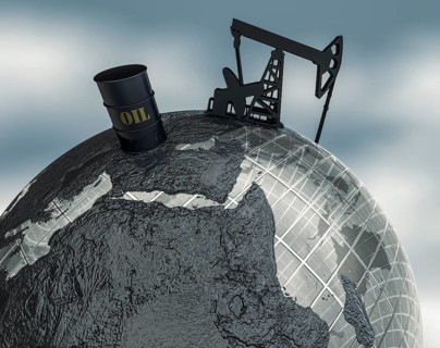 Globe with oil barrel and drilling rig