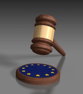 Gavel in front of grey background