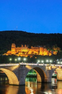Heidelberg Castle with Karl Theodor Bridge at dusk