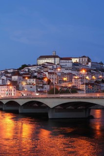 Historic centre with University and Mondego River at dusk