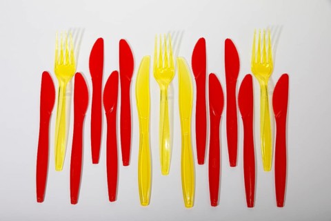 Red and yellow plastic cutlery