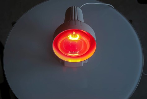 Luminous infrared lamp on the table