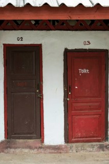 Toilet hut with red doors