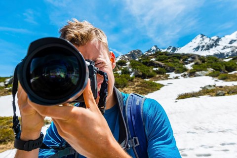 Young man photographing