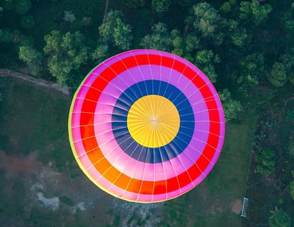 Colorful hot air balloon in the air from above