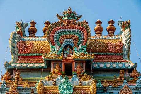 Colorful and decorated Hindu temple with idols of Hindu worship