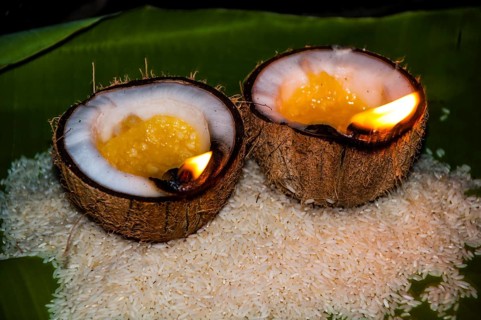 Offerings of rice and oil burning lamps in coconut shells