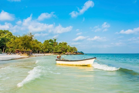Idyllic beach with motor boat