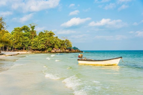 Idyllic beach with motor boat