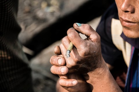 Man smoking cigarillo