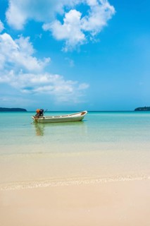 Motorboat on idyllic sandy beach