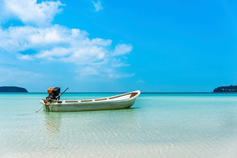Motorboat on idyllic sandy beach