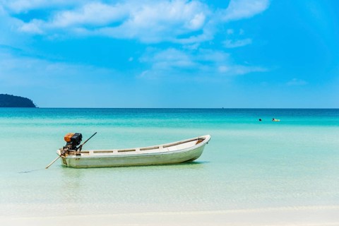 Motorboat on idyllic sandy beach