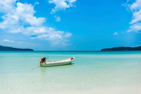 Motorboat on idyllic sandy beach
