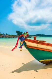 Idyllic sandy beach with traditional long-tail boat at Long Beach