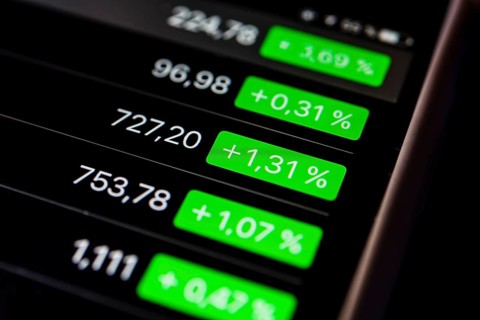 Close up of rising stock prices on smartphone screen
