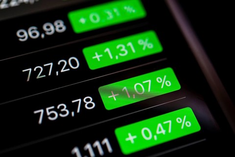 Close up of rising stock prices on smartphone screen