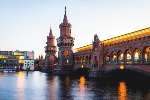 Oberbaum Bridge with underground between Kreuzberg and Friedrichshain at sunset