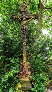 Old grave cross in the cemetery next to the ghost church of Lukova