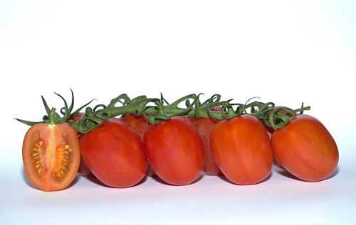 Vine tomatoes with one cut in half