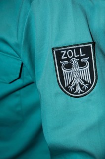 Emblem of German customs with eagle on a uniform shirt