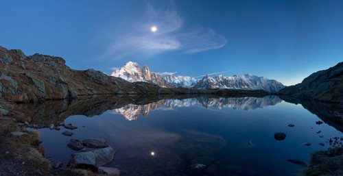 Moon and Mont Blanc reflected in the Lac des Chesery after sunset