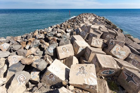 Pictures of famous musicians painted on stones at the Auditorio de Tenerife