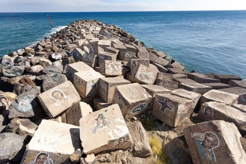 Pictures of famous musicians painted on stones at the Auditorio de Tenerife