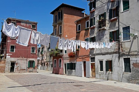 Laundry drying on clothes lines across the street