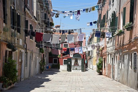 Laundry drying on clothes lines across the street