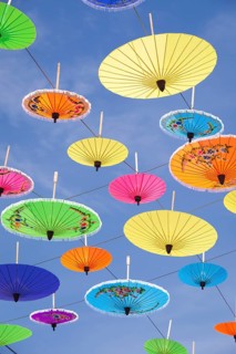 Colourful umbrellas suspended in the air at the umbrella festival in Bo Sang near Chiang Mai