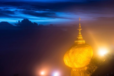 Illuminated Golden Rock at night with Kyaiktiyo Pagoda