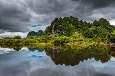 Karst hills with dark clouds