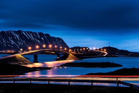 Illuminated bridge to the village Fredvang