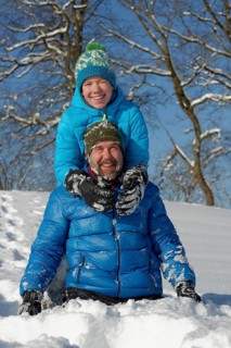 Father and son playing in the snow