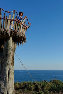 Girl standing on lookout tower at Cape Kamenjak