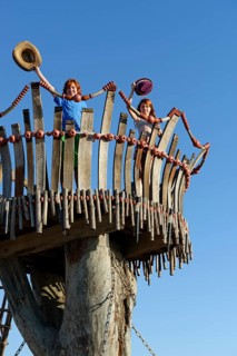 Boy and girl standing on lookout tower at Cape Kamenjak