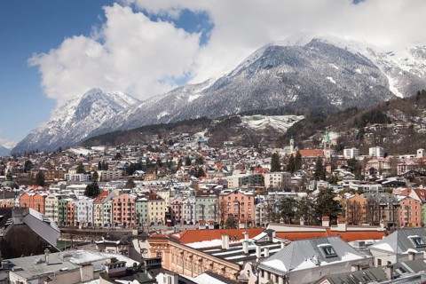View from the town tower onto the city towards the Inn and the Karwendel Mountains