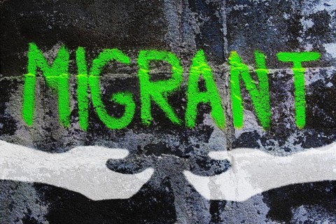 Graffiti on migration reading migrant