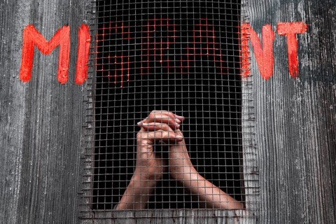 Hands behind bars