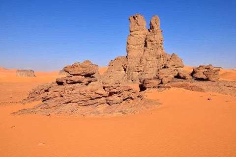Sanddunes and rock towers at Moul Naga