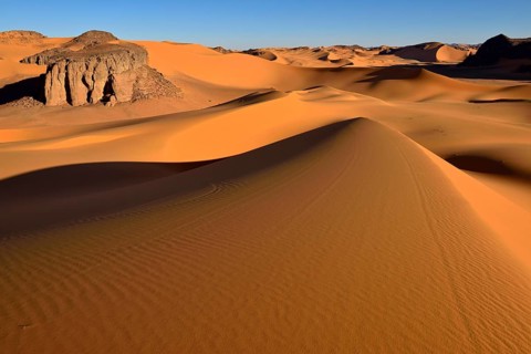 Sanddunes and rock towers at Moul Naga