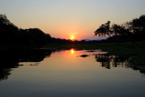 Sunset at a branch of the Zambezi river