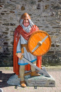 Tourist behind Viking figure