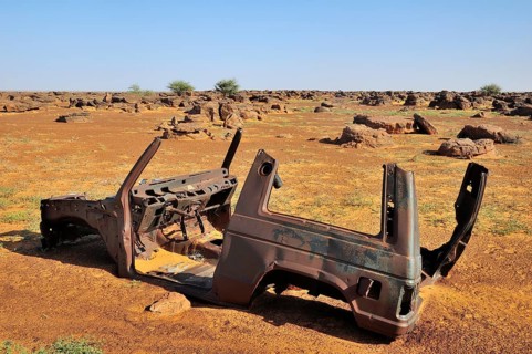 Wreck of an SUV in the desert
