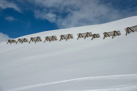 Avalanche control on the mountain slope with snow