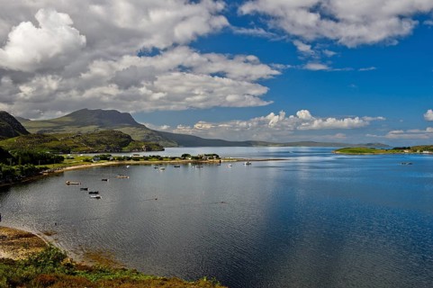 Headland with Ardmair Point Holiday Centre at Loch Kanaird in Ullapool